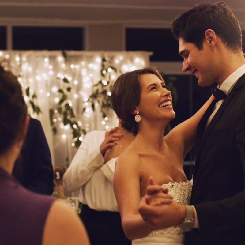 Couple celebrating at Bellamere Winery with outdoor ceremony and indoor reception under chandeliers